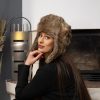 Бежова шапка заек - ушанка с бежово-кафява козина и тъмнокафяви петна, обла форма на купола